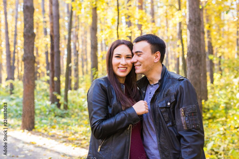 Love, relationship, family and people concept - smiling couple hugging in autumn park Love, relationship, family and people concept - smiling couple hugging in autumn park