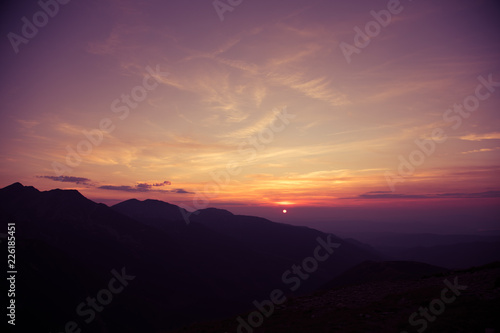 A beautiful  minimalist scenery of mountain sunset in purple tones. Abstract  colorful mountain landscape. Tatra mountains in Slovakia  Europe.