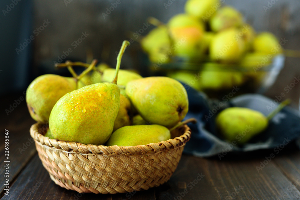 Fresh garden pears on dark wooden table Fresh garden pears on dark wooden table