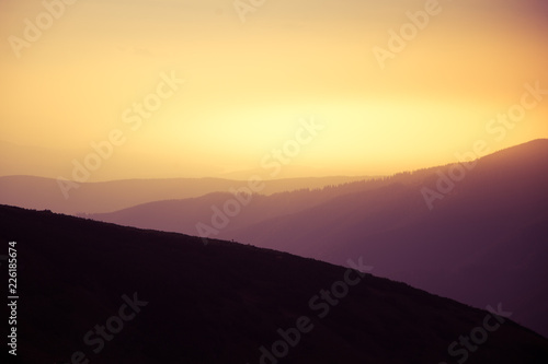 A beautiful, abstract, colorful sunset scenery in mountains in warm tones. Mountain landscape in colors. Tatry mountains in Slovakia, Europe.