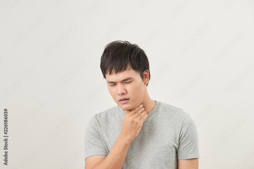 Allergies and sore throat concept. Sick young man on white background Allergies and sore throat concept. Sick young man on white background