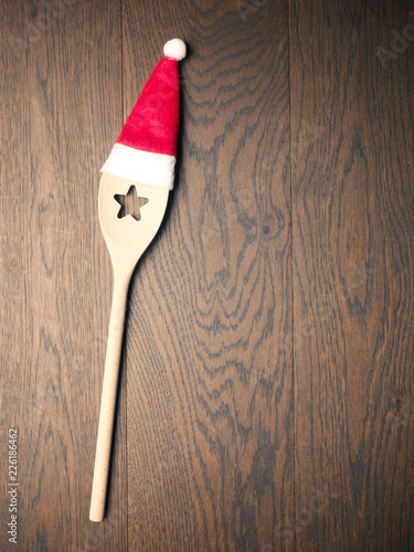Wooden cooking spoon with hat of Santa