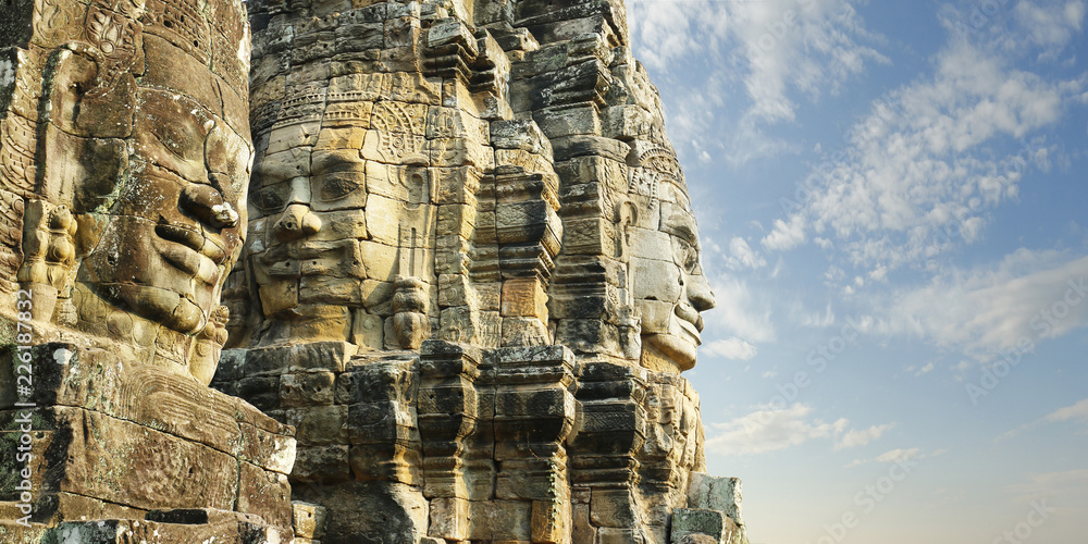 Naklejka premium carved faces at Angkor wat temple, bayon,Cambodia