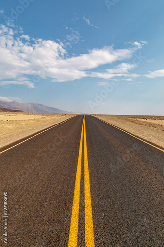 A long road through the Death Valley desert, in California