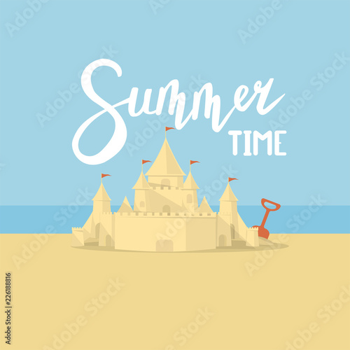 sand castle on the background of the sea and the beach