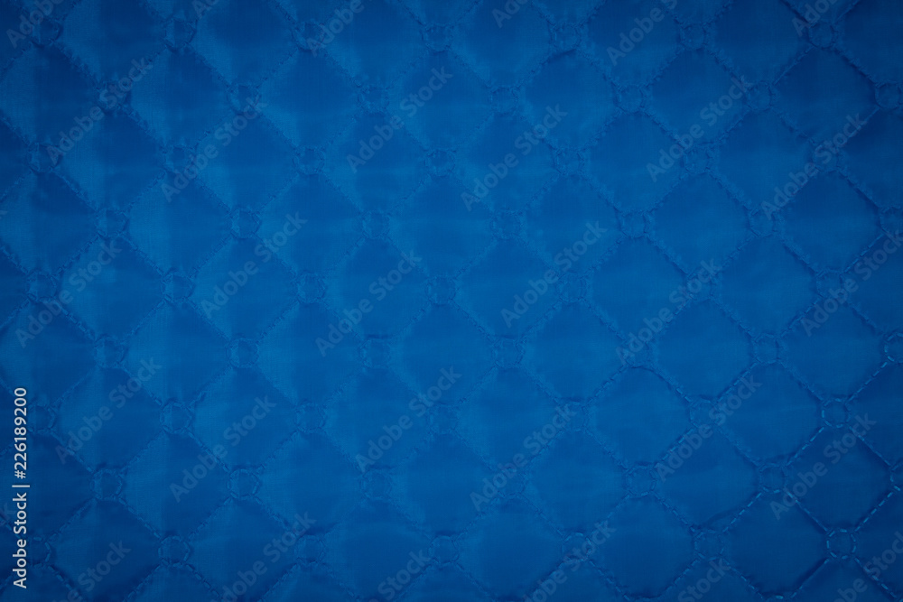 Fabric velour quilted close-up. Quilted surface upholstery Fabric velour quilted close-up. Quilted surface upholstery