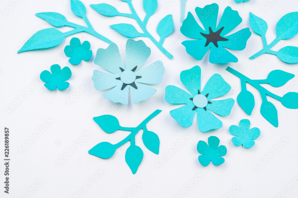 Fototapeta premium Flower and leaf of blue color made of paper