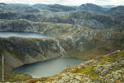 A beautiful landscape of a mountain lake in Folgefonna National Park in Norway. Overcast autumn day in mountains. Autumn scenery of lake.