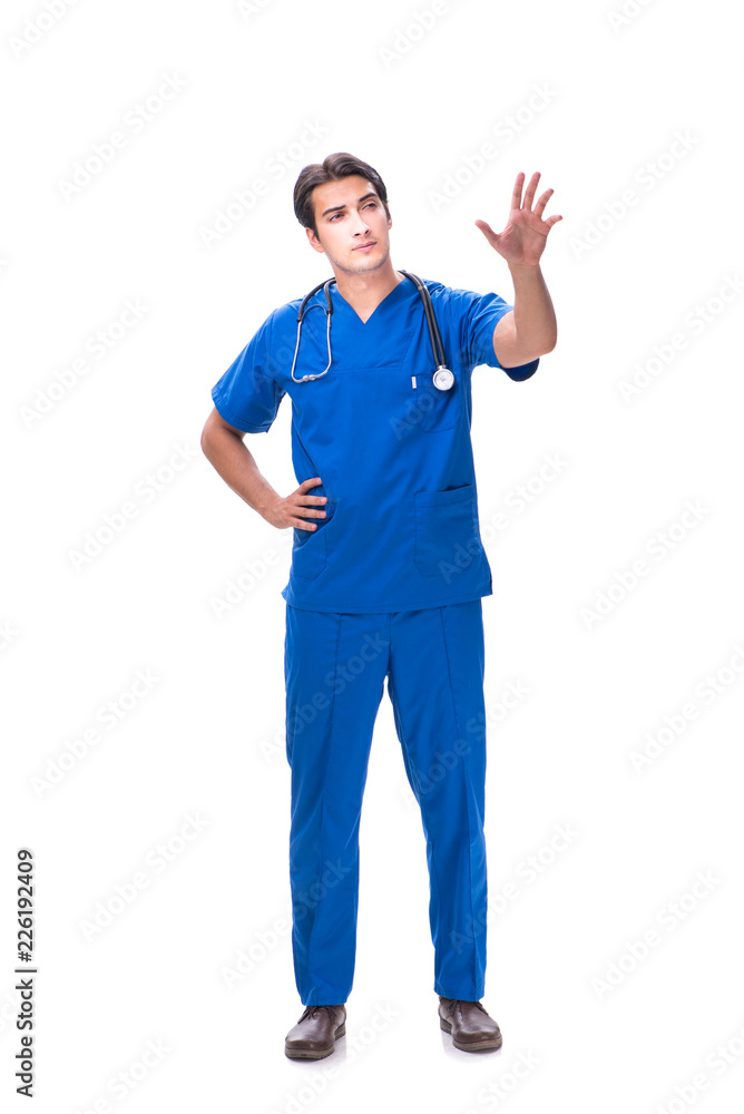 Young male doctor pressing buttons isolated on white Young male doctor pressing buttons isolated on white