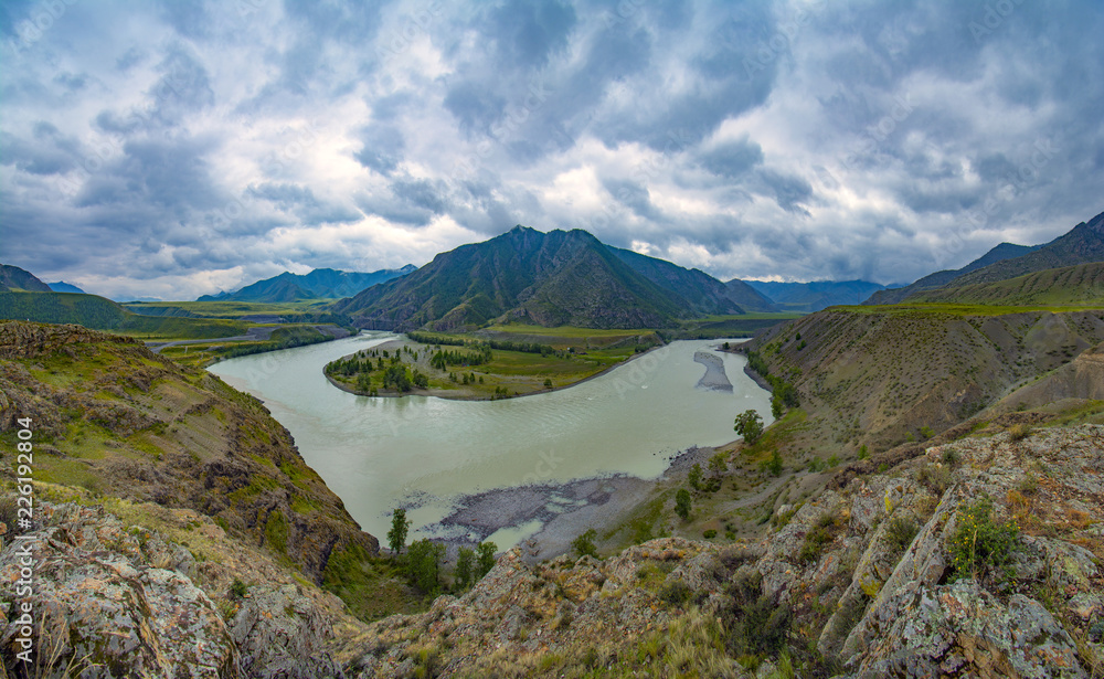 The place is the confluence of two famous altai rivers Chuya and Katun. Panorama of the Katun river valley in a beautiful sunny day. Rest on the Katun River. Altai landscape