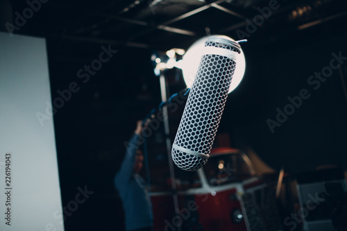 Sound engineer holding a microphone photo