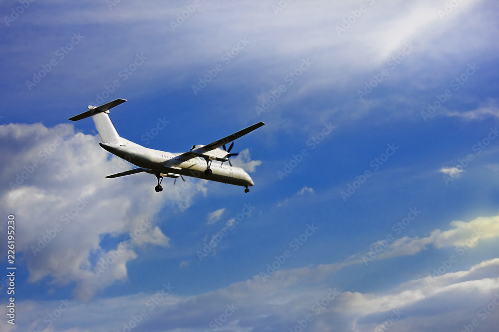 flying plane in blue clear sky close-up