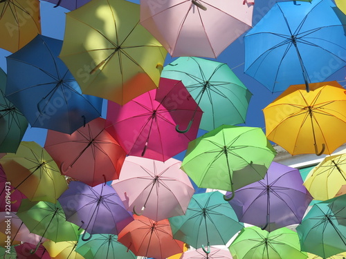 colorful umbrellas on a background of blue sky