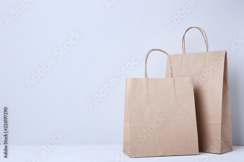 Brown shopping bags on grey background
