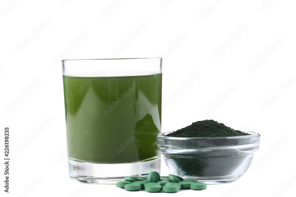 Spirulina drink and tablets with powder in bowl on white background Spirulina drink and tablets with powder in bowl on white background