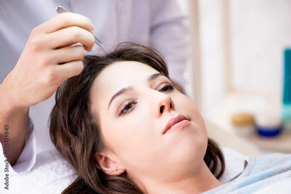 Fototapeta premium Woman visiting doctor cosmetologyst in beauty concept