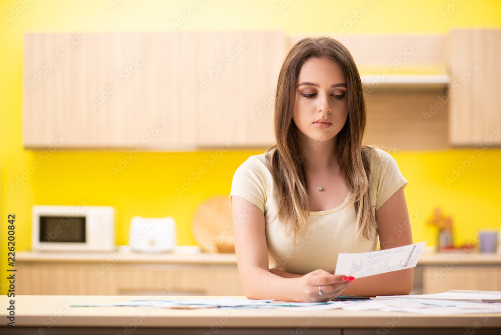 Young woman wife in budget planning concept Young woman wife in budget planning concept