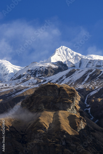 Mountain peak in the morning with blue sky in Nepal