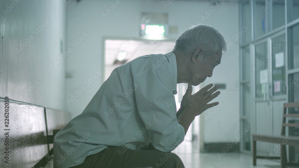 Asian senior elderly man worry about health medication fee at hospital Asian senior elderly man worry about health medication fee at hospital