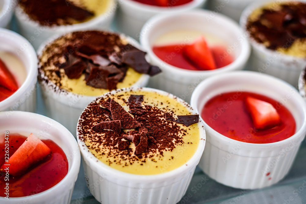 Assorted desserts puffs tarts puddings cakes creme brulee Assorted desserts puffs tarts puddings cakes creme brulee