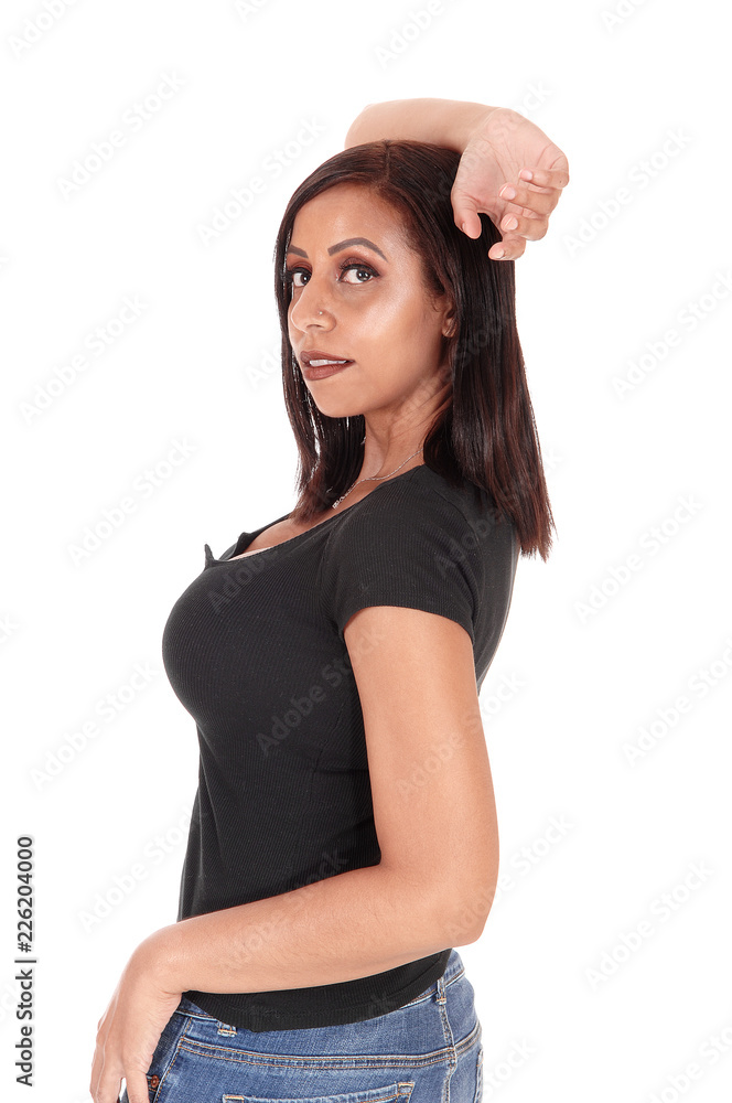 Lovely young woman standing in profile Lovely young woman standing in profile
