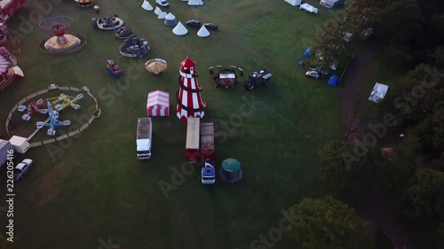 Aerial footage of Silcocks fair. Rolling descending shot down across funfair. photo