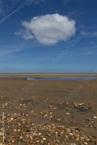 Stones and beautiful cloud at Wells-next-the-Sea
