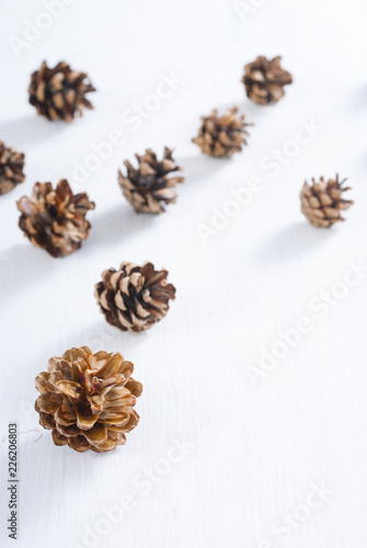 pine cones on white wood table, purity Christmas decoration