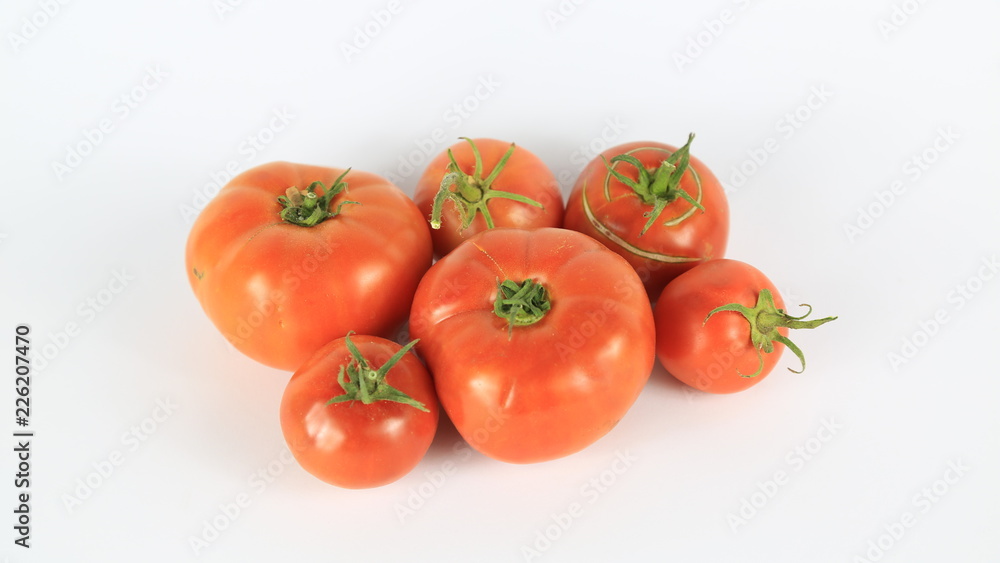 Fresh Tomatoes On Isolated White Background Fresh Tomatoes On Isolated White Background