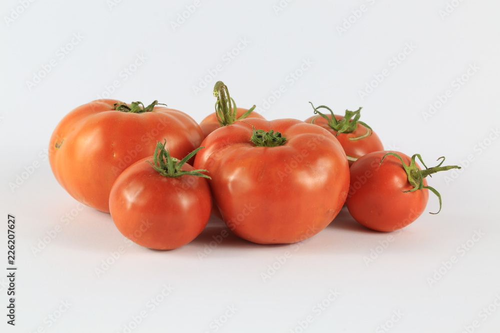 Fresh Tomatoes On Isolated White Background Fresh Tomatoes On Isolated White Background