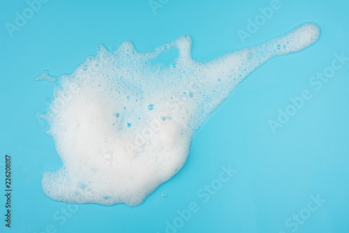Foam bubble on blue background on top view object beatuy health care concept design