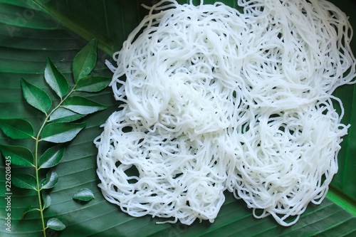 Idiyappam/ String Hoppers - Traditional Kerala Steamed Breakfast served with Chickpea curry photo