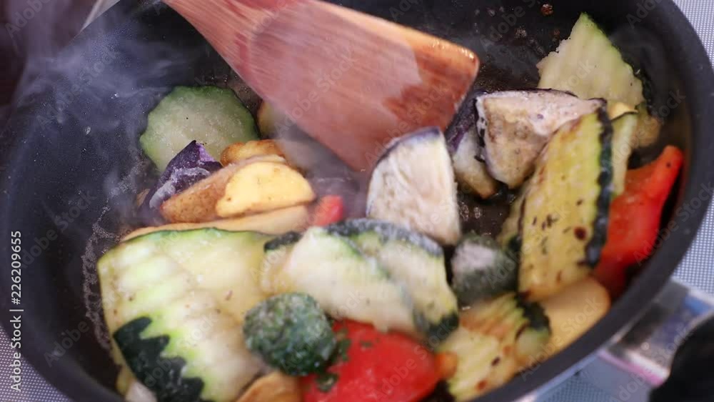 Cooking vegetables in a frying pan, stir fry Cooking vegetables in a frying pan, stir fry