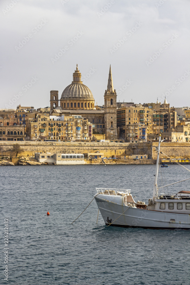 Valletta skyline as seen from Sliema, with a part of a boat in the foreground, at Valletta, Malta