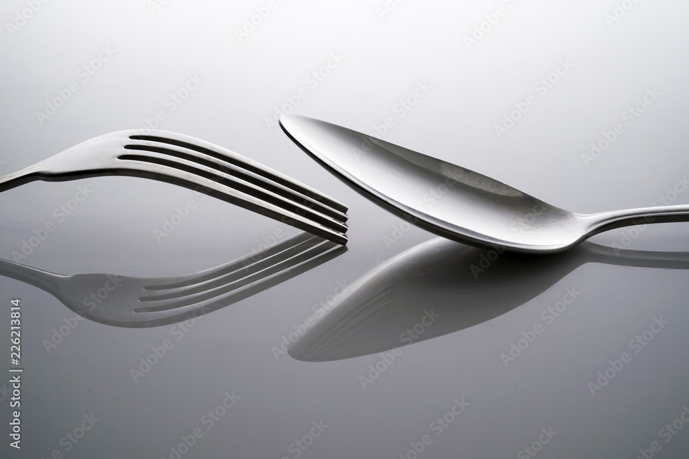 Fork & Spoon Kitchen Utensils fine art abstract on white isolated background Fork & Spoon Kitchen Utensils fine art abstract on white isolated background