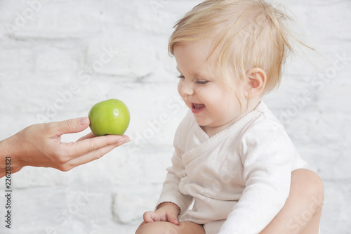 Fresh organic apple as perfect healthy finger food for little ones