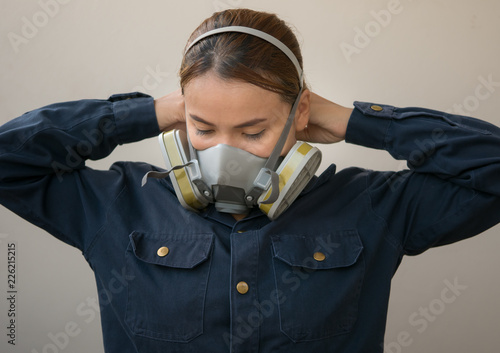 women protection cartridge respirator gas mask - close up. photo