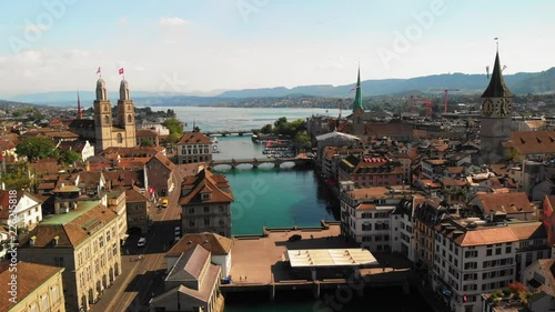 Drone dollyshot over the river Limmat in Zurich, Switzerland on a peaceful, warm and sunny summer evening photo