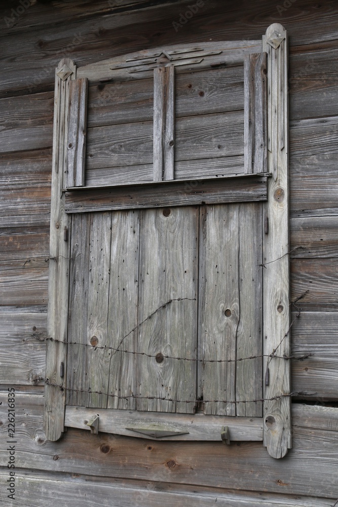 barred old wooden window