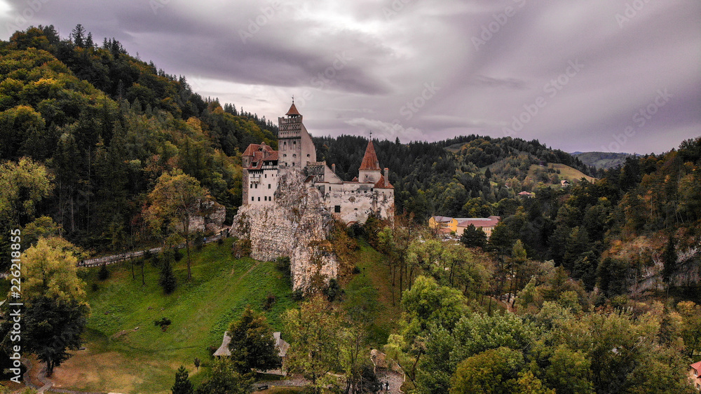Aerial view of Bran castle in beautiful Transylvania, region of Romania. Cloudy day with dark clouds Aerial view of Bran castle in beautiful Transylvania, region of Romania. Cloudy day with dark clouds