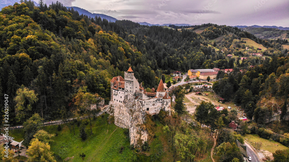 Aerial view of Bran castle in beautiful Transylvania, region of Romania. Cloudy day with dark clouds