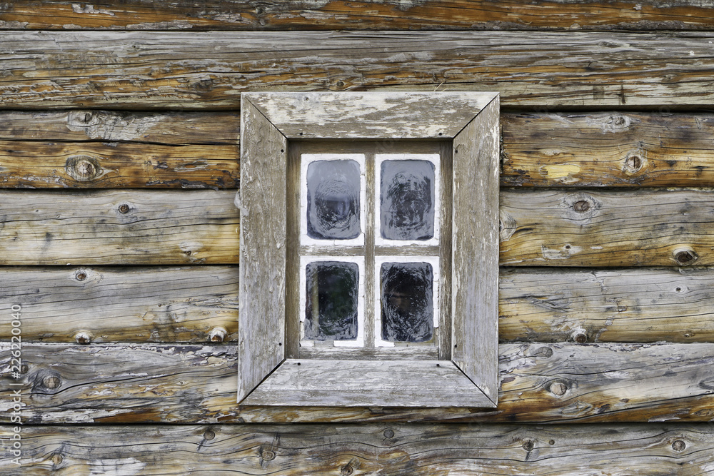A small window of an old log house