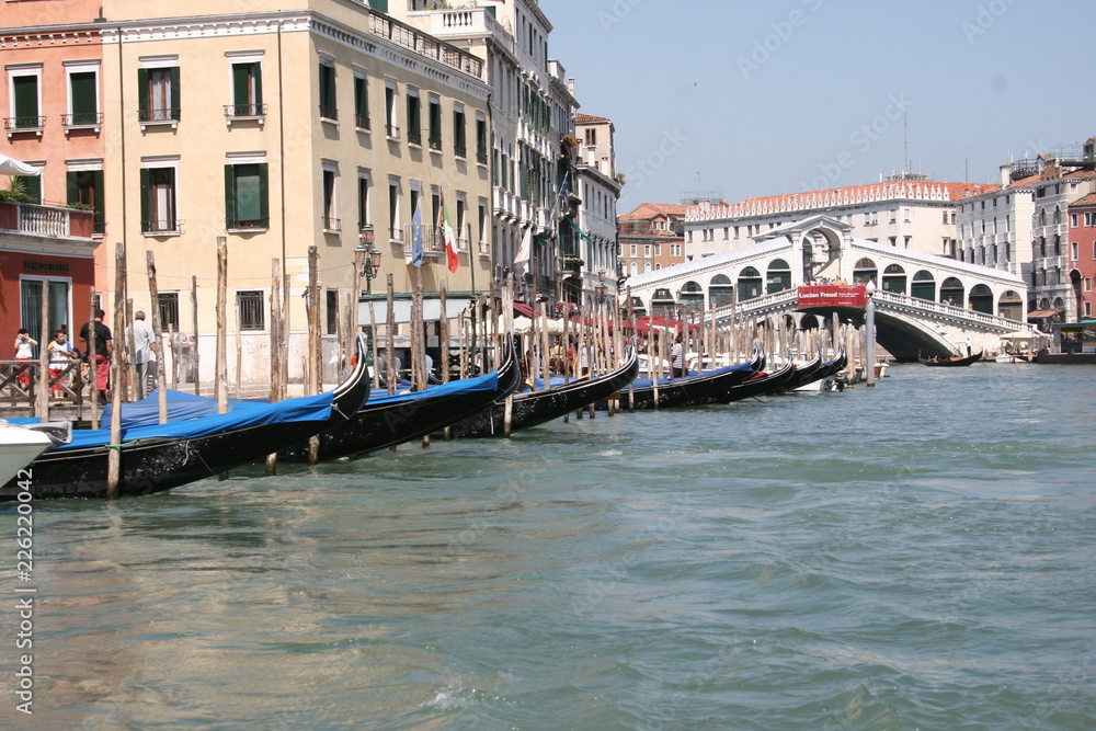 Obraz premium Gondola on canal in Venice, buildings in background Italy
