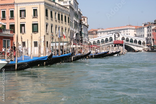 Gondola on canal in Venice  buildings in background Italy