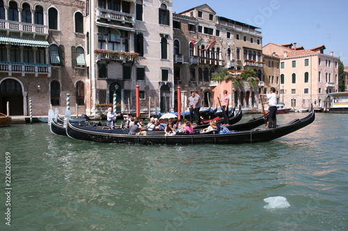 Gondola on canal in Venice, buildings in background Italy