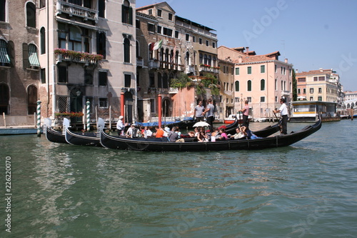 Gondola on canal in Venice, buildings in background Italy © Andrea