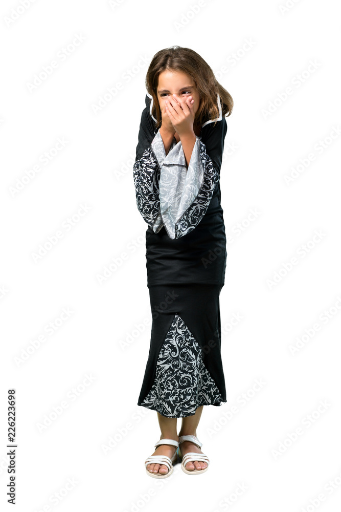 A full-length shot of a Little girl dressed as a vampire for halloween holidays laughing isolated on white A full-length shot of a Little girl dressed as a vampire for halloween holidays laughing isolated on white