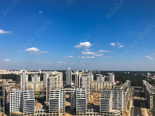 Panoramic view from a great height on the beautiful capital, a city with many roads and high-rise buildings. View of the city from the observation deck from a height. Urban landscape against the sky