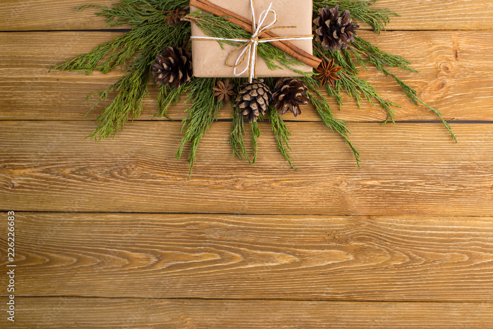 Gifts and fir branches form a frame. Concept blank for a Christmas card. Copy space, top view. Gifts and fir branches form a frame. Concept blank for a Christmas card. Copy space, top view.