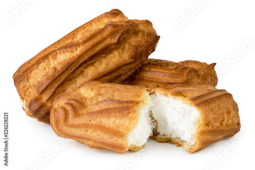 Eclairs with cream and broken in half on a white, isolated.